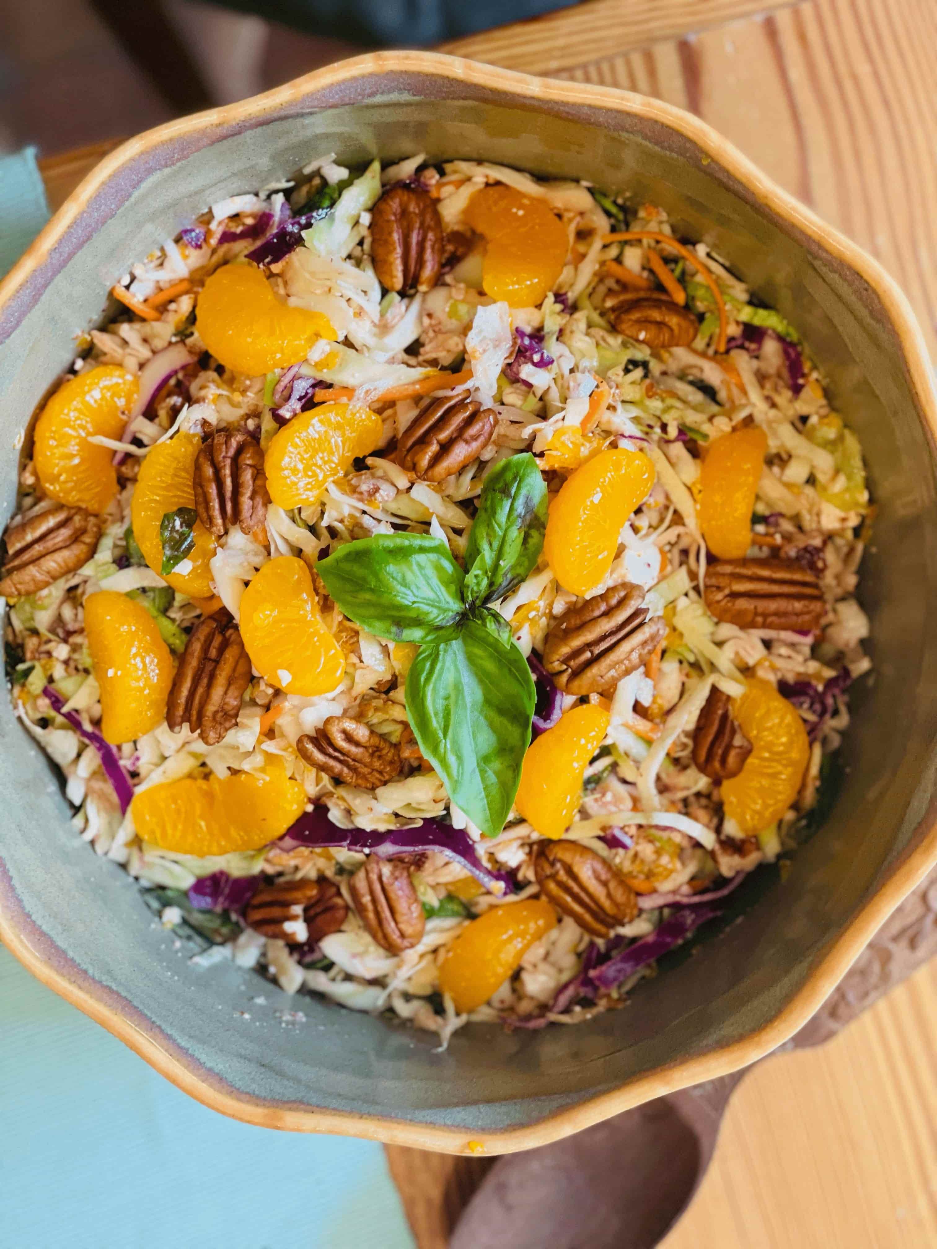 Mandarin Orange Pecan slaw in a bamboo bowl